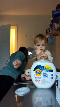 A baby playing with a Tide Pod while the mother had her back turned for just a second.
